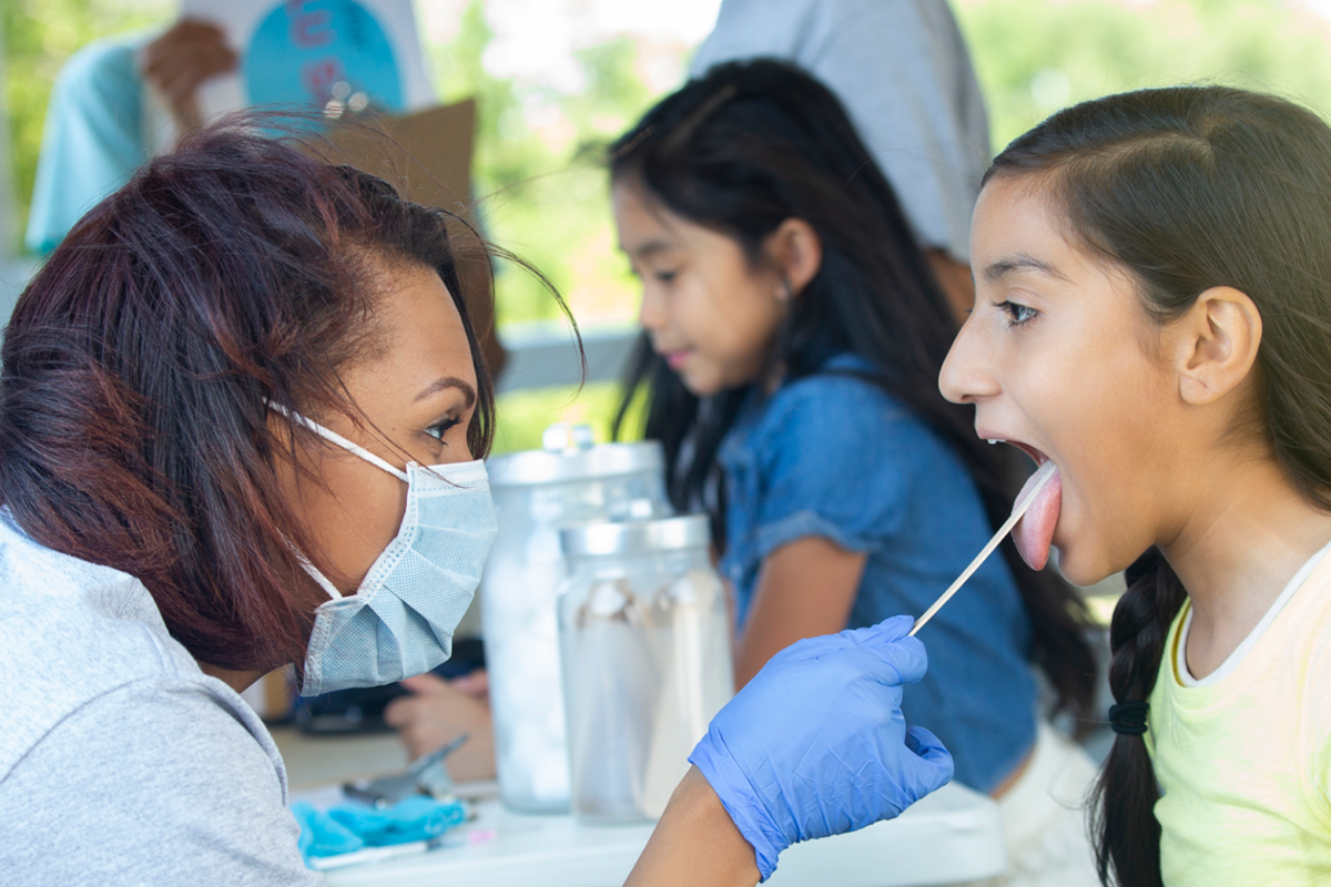 swabbing Nurse swabbing a child's mouth