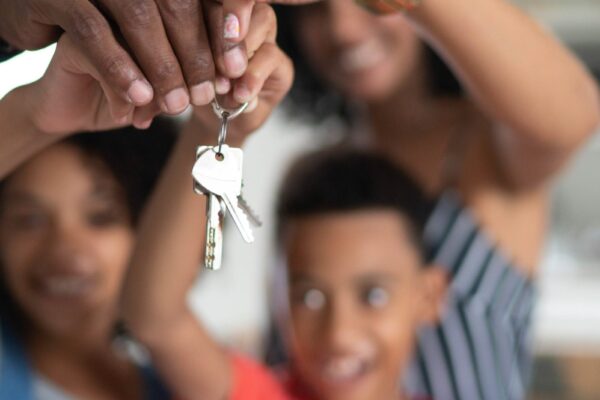 Latin Family Holding The Keys Of Their New House