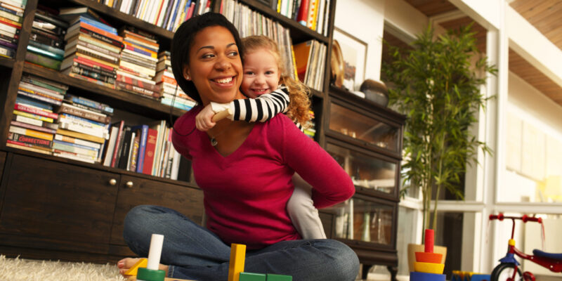 A mom and child demonstrate housing affordability to improve health