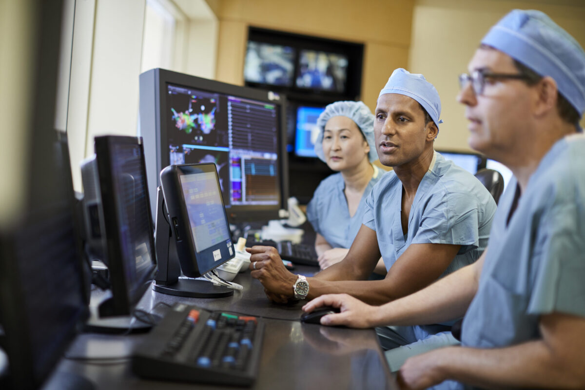 Electrophysiology doctors viewing scans