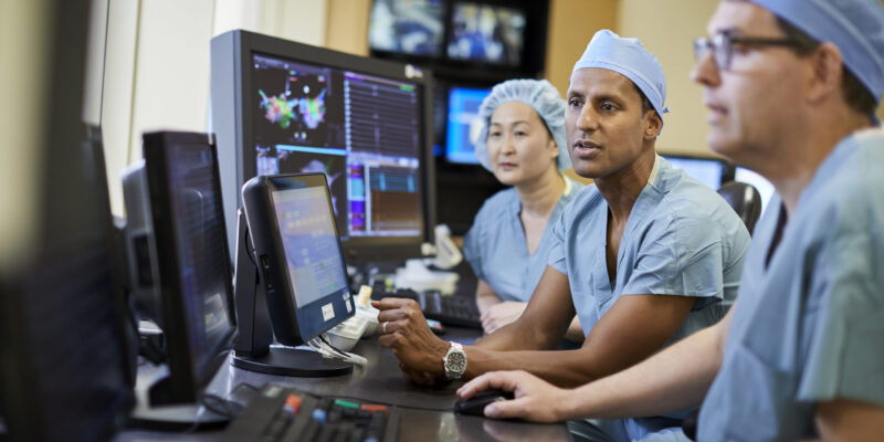 Electrophysiology doctors viewing scans