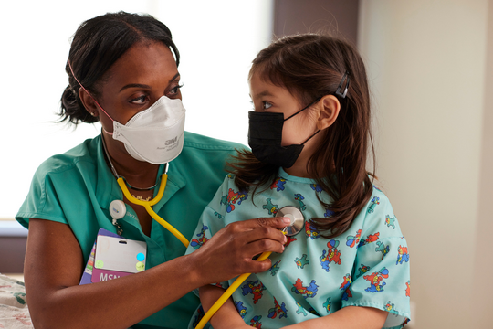 Nurse And Child Wearing Masks