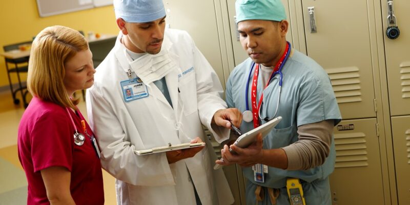 Surgical staff conferring