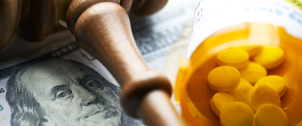 High Cost Of Prescription Drugs: Concept Prescription Bottles With Gavel