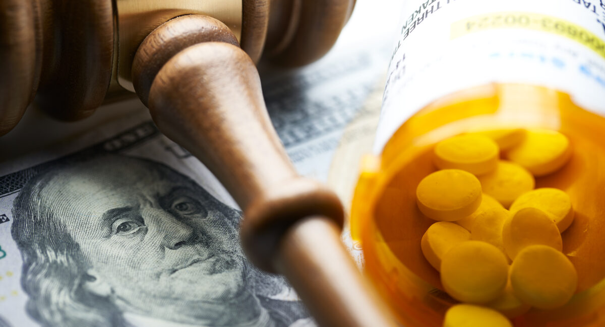 High Cost of Prescription Drugs: Concept prescription bottles with gavel