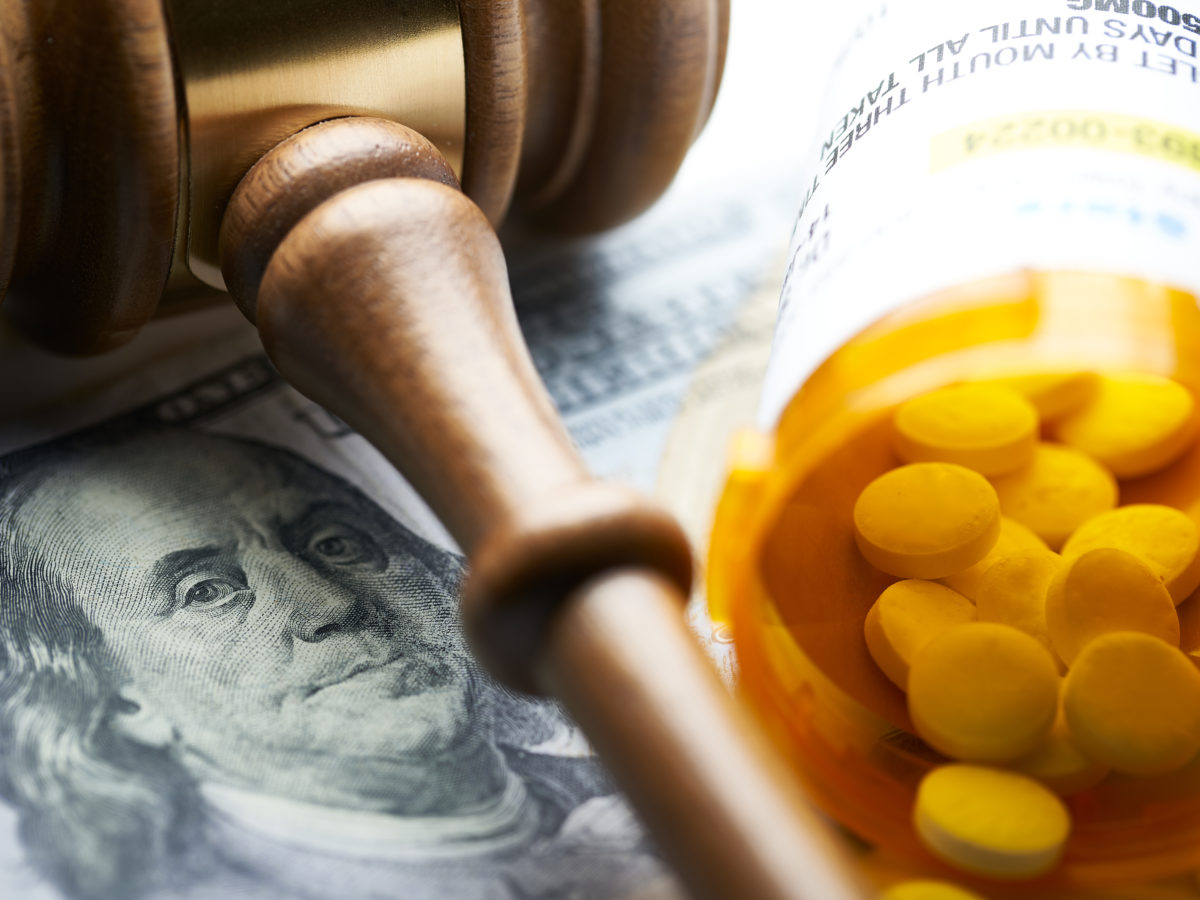 High Cost Of Prescription Drugs: Concept Prescription Bottles With Gavel