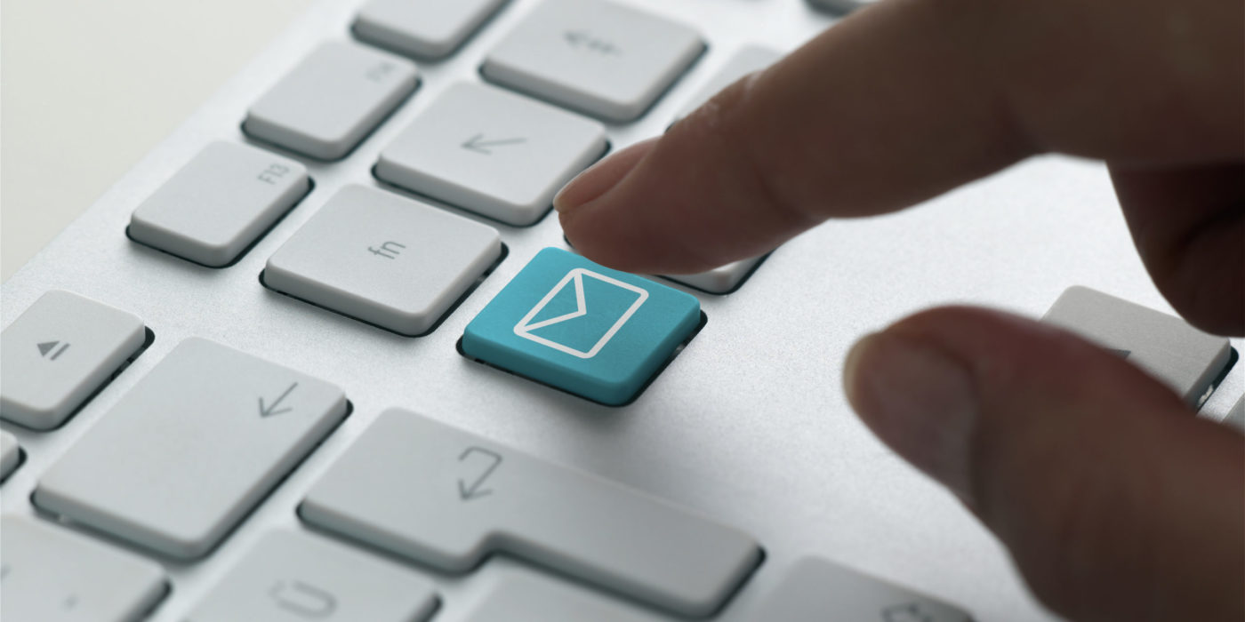 Business e-mail on a computer keyboard.