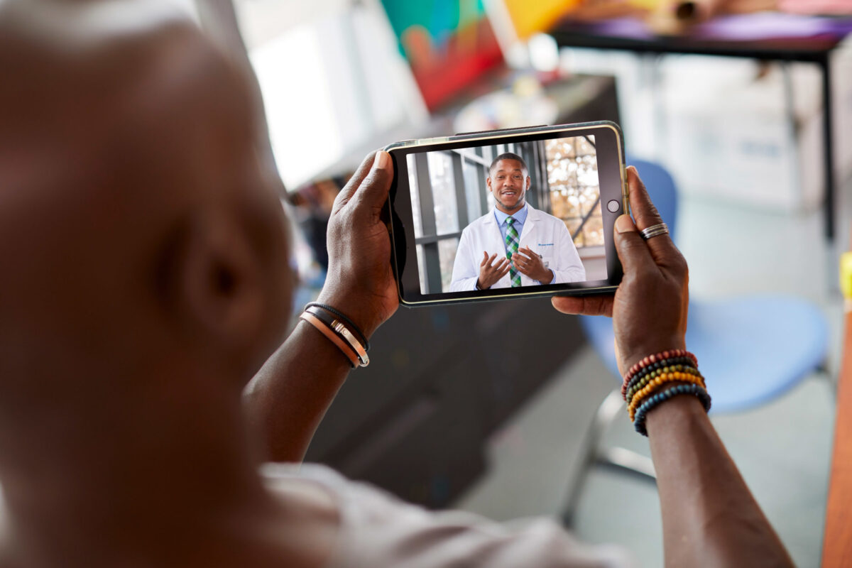 Man on teleheath call with physician