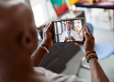 Man on teleheath call with physician